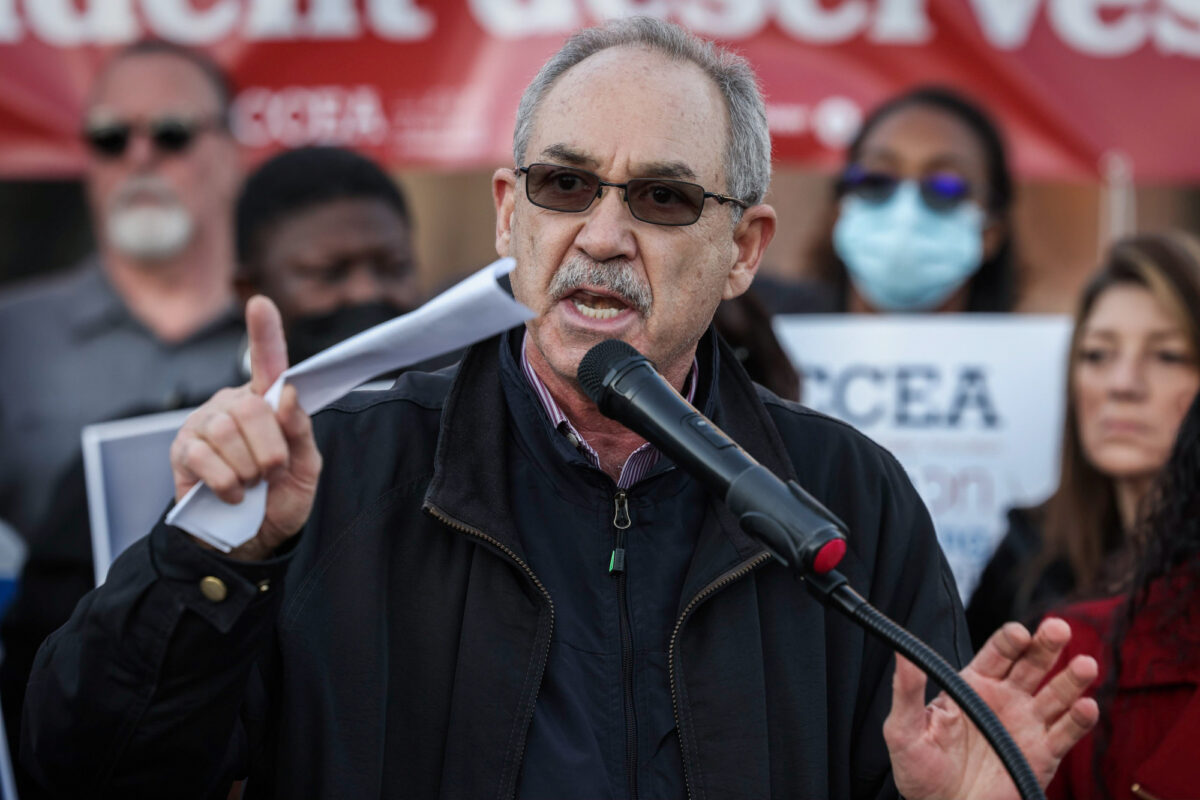 John Vellardita, executive director of the Clark County Education Association, speaks during a rally.